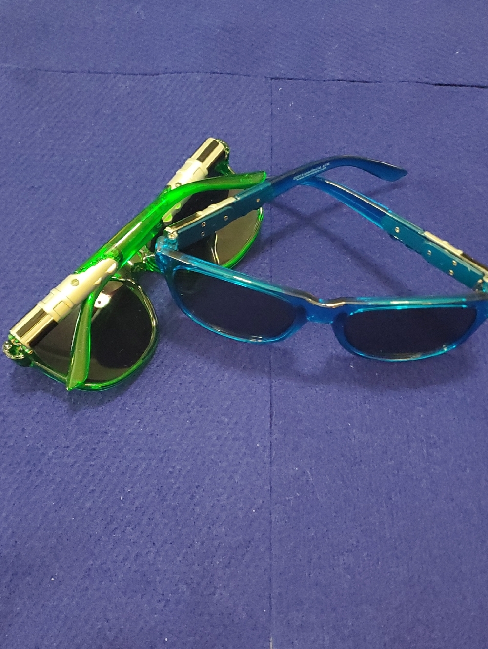 2 Pairs Kids Lightsaber Sunglasses. One Blue, One Green. Great Condition.